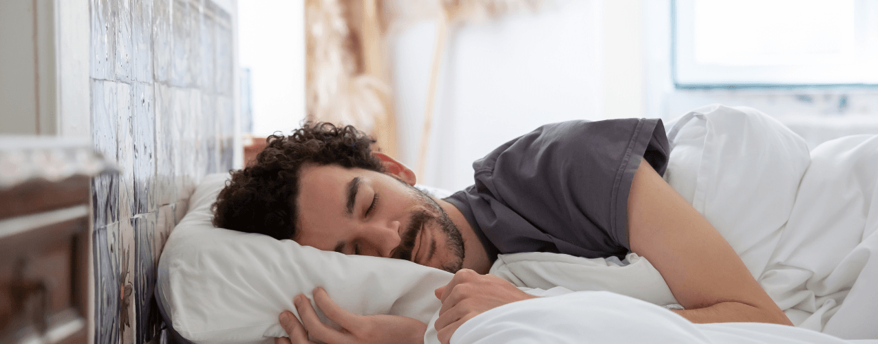 Male sleeping in bed