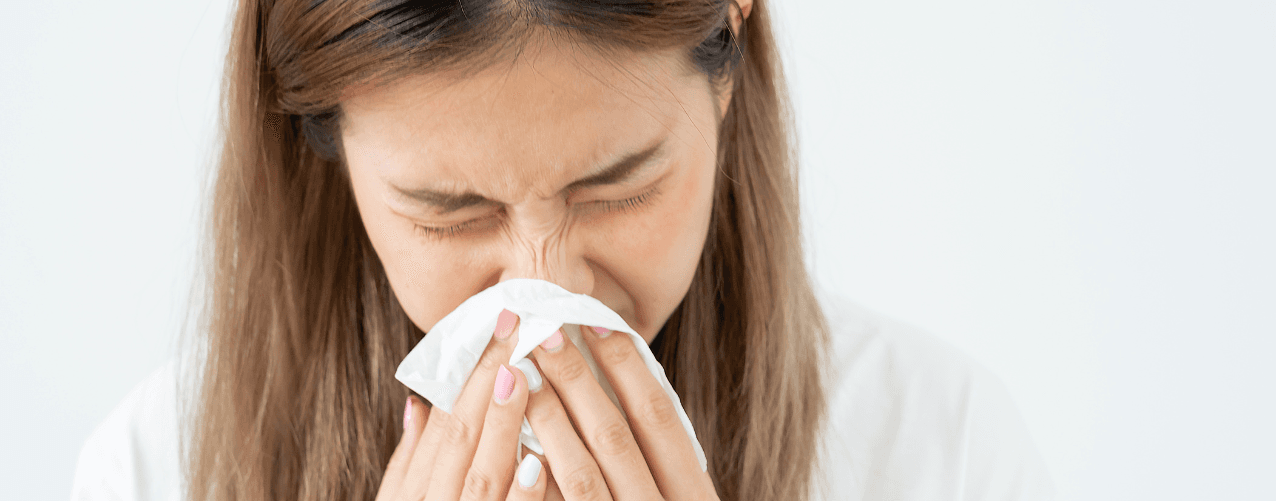 Female blowing nose