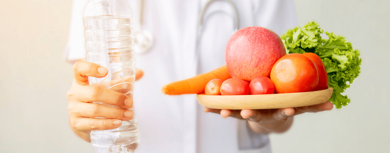 Glass of water with fruit and vegetables