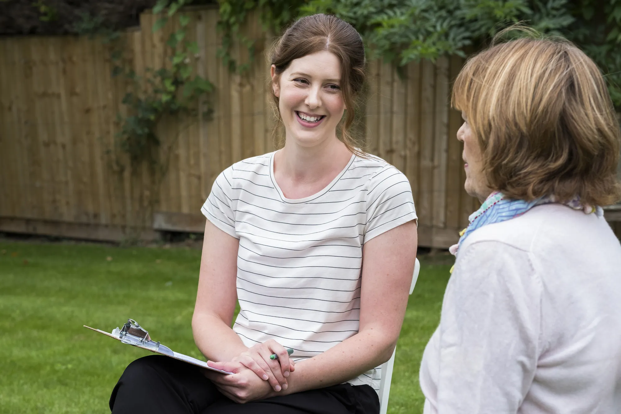 Therapist and patient talking outdoors